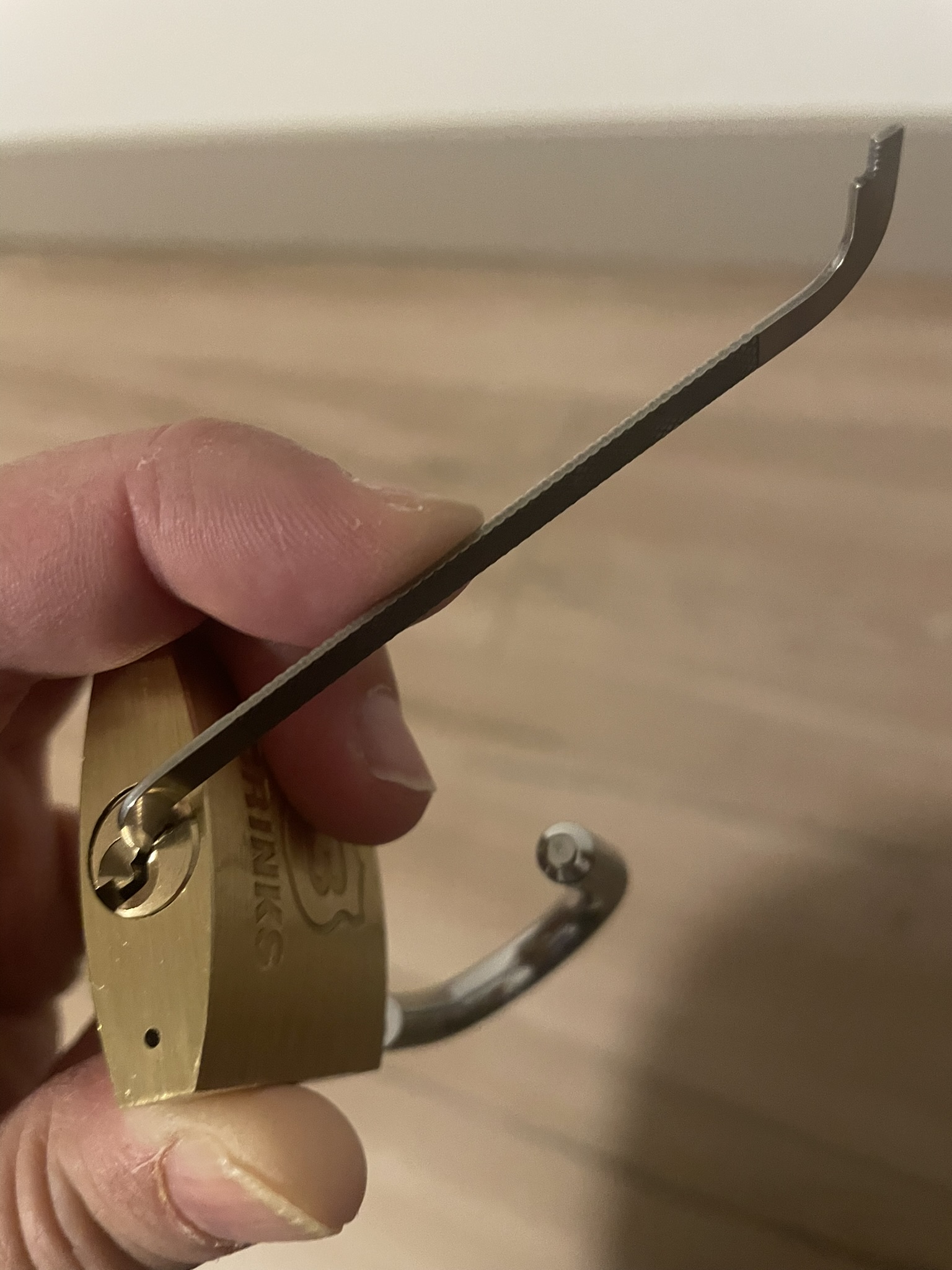 Brinks brass padlock, picked for white-belt rank