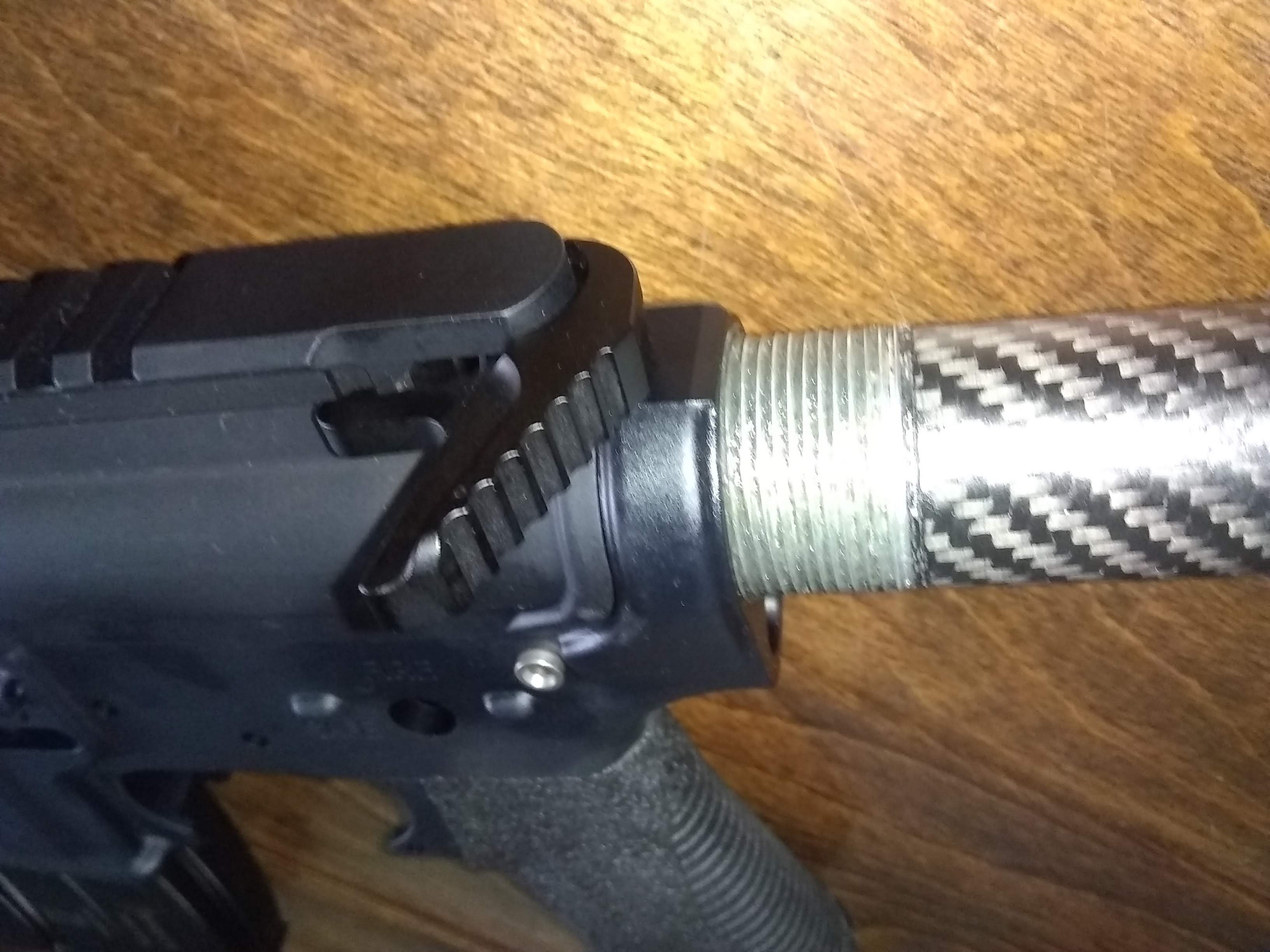 The Fortis Clutch charging handle weighs in at 1.06 oz. It's single-sided, but this is the only side that has a real function in mil-spec charging handles anyway. As pictured, the weight is now 3 lb, 12.1 oz.