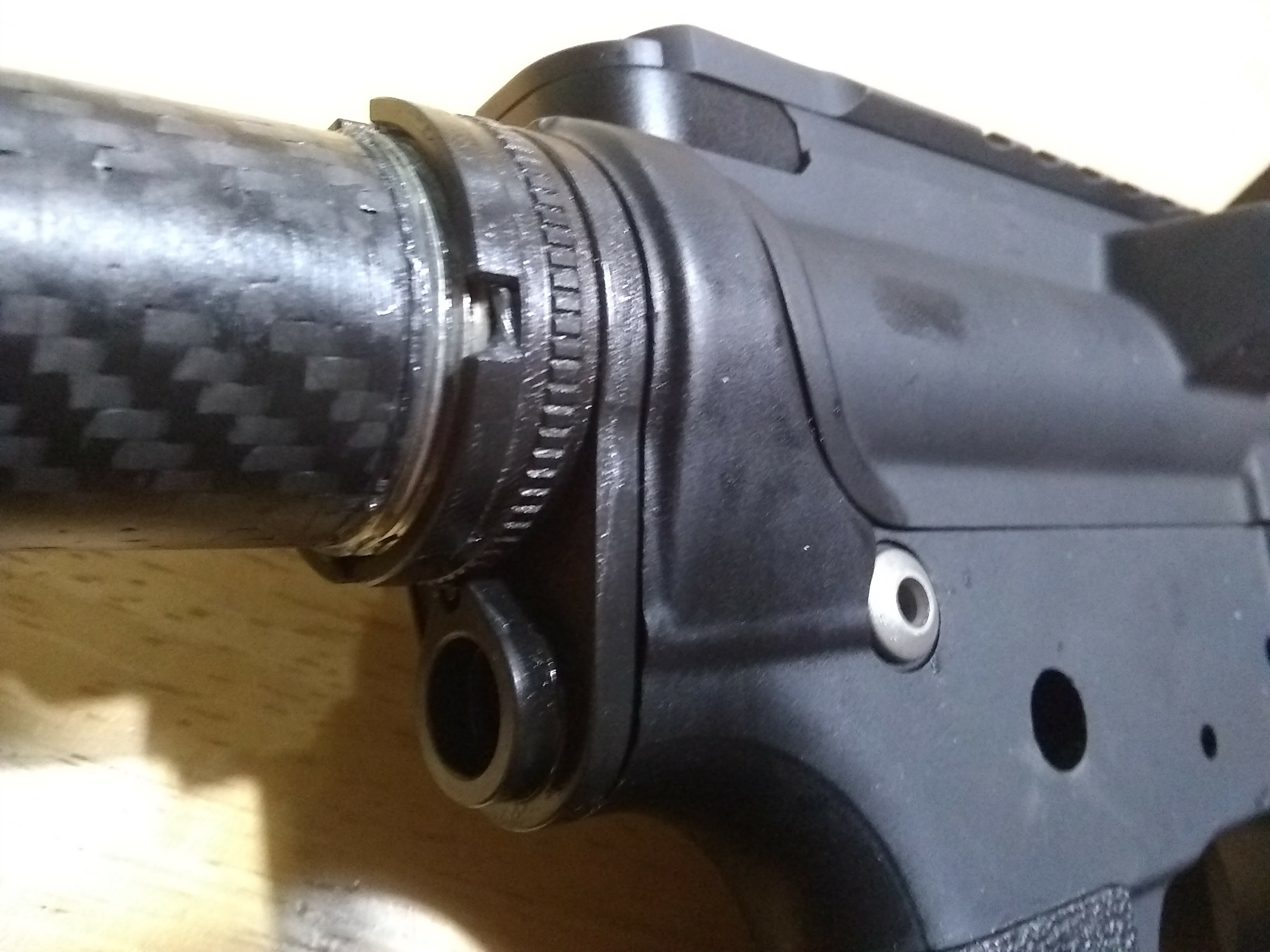 The endplate has a quick-detach mounting point for a sling. The ratcheting nut doesn't require staking. Both are produced by Primary Weapon Systems of Boise, just around the corner.